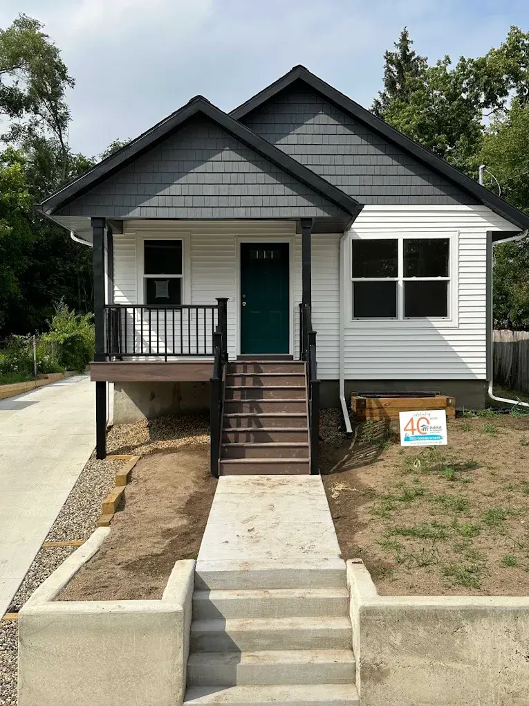 Completed new home exterior with covered porch and quality finishes