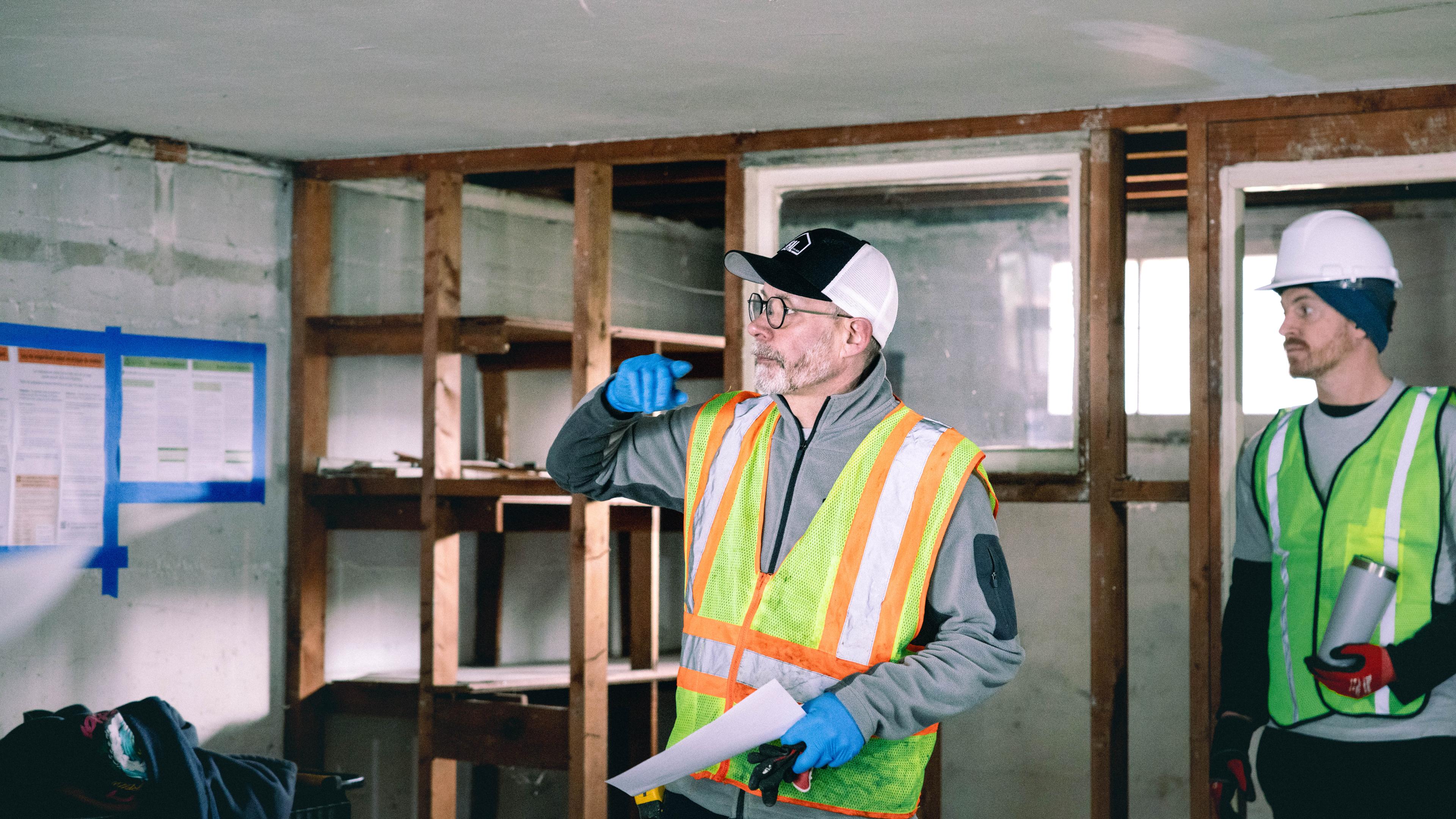 Interior room under renovation with exposed framing