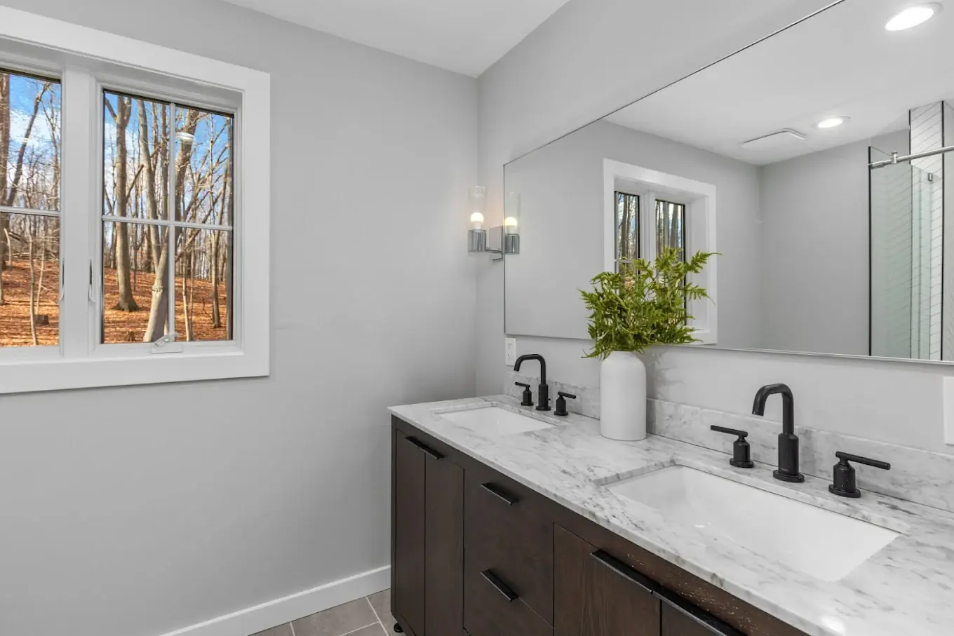 Bathroom shower remodel in progress showing Kerdi waterproofing membrane installation