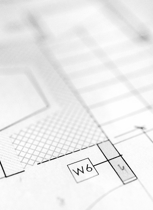 Team member marking measurements during a remodel